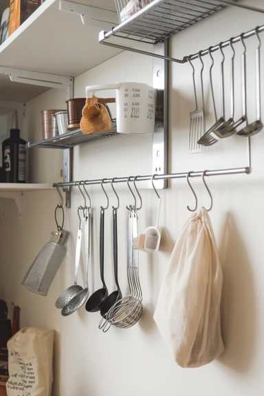 20 Walk-In Pantry Organization Ideas For Real Homes 20 Install Hooks or Rails for Hanging Utensils and Tools