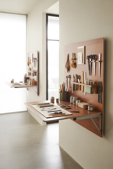 Fold-Down Wall Work Surfaces for Temporary Expansion
