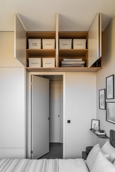 23 Small Bedroom Organizing Hacks That Maximize Every Inch 22 Overhead Storage Cabinets That Use Doorway Air Space
