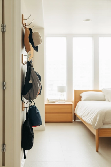 16. Over-Bed Shelving That Builds a Storage Wall