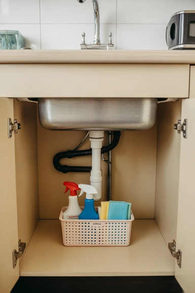 21 Small Kitchen Organization Ideas for Apartments That Actually Work 20 Keep a Contained Cleaning Zone Under the Sink