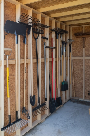 21 Shed Storage Organization Ideas That Keep Tools Visible 3 Vertical Tool Racks Along Stud Walls