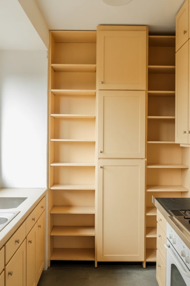 23 Small Kitchen Remodel Ideas That Maximize Every Inch 9 Extend Cabinets to the Ceiling