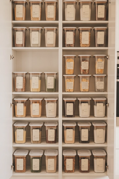  Use Matching Containers to Visually Expand Cabinet Space