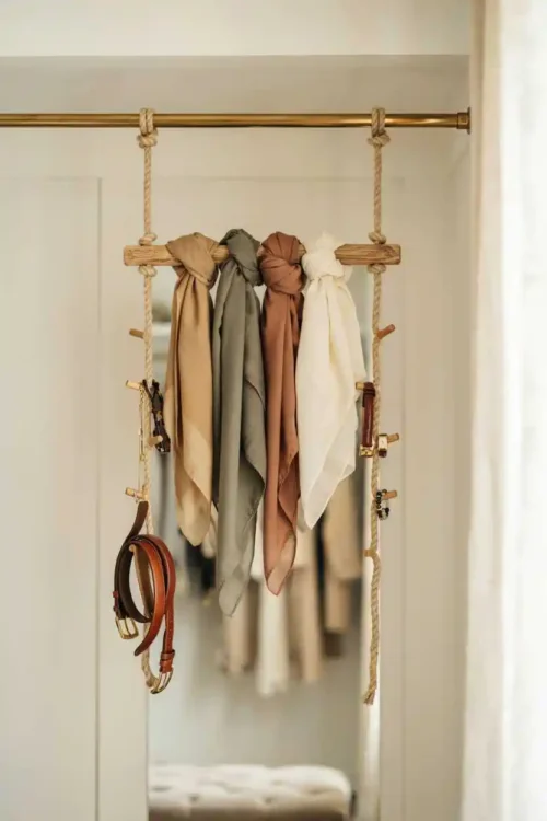27 DIY Closet Organization Ideas Anyone Can Build 18 Rope and Dowel Hanging Organizer for Rod Accessory Overflow